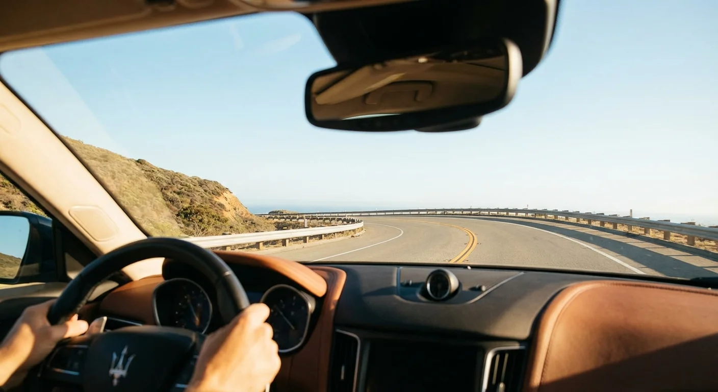 A view of an open, clear road from the driver's perspective inside a safe car.
