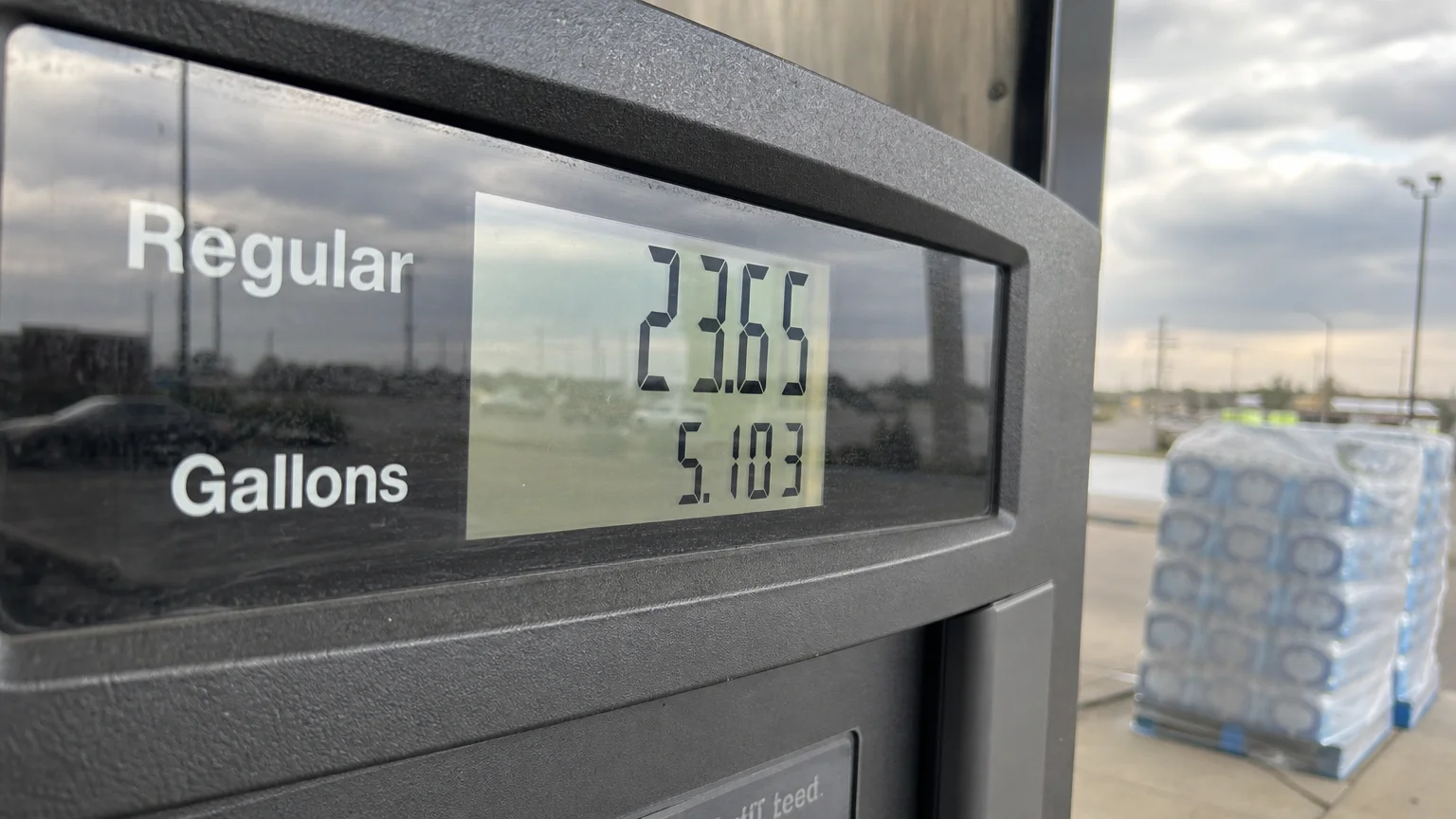 Close-up of a gas pump screen showing rising fuel costs during a period of inflation.